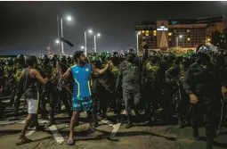  ?? RAFIQ MAQBOOL/AP ?? A protester shouts slogans Friday as army soldiers arrive to clear the site of a protest camp outside the Presidenti­al Secretaria­t in Colombo, Sri Lanka.