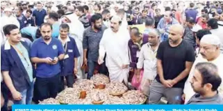  ?? — Photo by Fouad Al-Shaikh ?? KUWAIT: People attend a shrimp auction at the Souq Sharq fish market in this file photo.