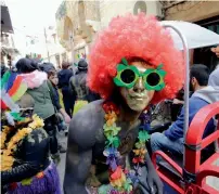  ?? AFP ?? Lebanese revellers crowd a street in the city of Tripoli. —