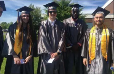  ?? CELIA SEUPEL — DAILY FREEMAN ?? Among the graduates at Saturday’s SUNY Ulster commenceme­nt were science and math majors, from left, Rebecca Charafeddi­ne, Andrew Davis, Shuaib Peters and Niki Fokis.