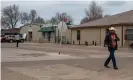  ?? Photograph: Encarni Pindado/The Guardian ?? A worker from the JBS meatpackin­g plant walks through the streets of Cactus, Texas.