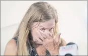  ?? RICHARD VOGEL — THE ASSOCIATED PRESS ?? Script Supervisor Mamie Mitchell wipes a tear during a news conference with her attorney Gloria Allred on Wednesday in Los Angeles. Allred announced a lawsuit on behalf of Mitchell, who was on set when a prop gun being used by Alec Baldwin went off.