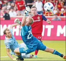  ?? (AP) ?? Real Salt Lake forward Corey Baird (27) watches his shot sail past Sporting Kansas City goalkeeper Tim Melia (29) and into the net during the first half
of an MLS soccer match on July 4, in Sandy, Utah.