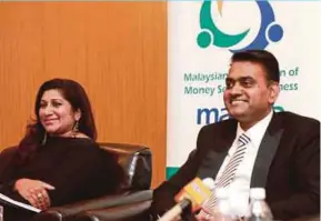  ??  ?? Malaysian Associatio­n of Money Services Business president Ramasamy K. Veeran (right) with chief executive officer Shalini Pavithran.