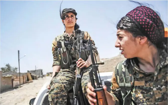  ??  ?? RAQA: Members of the Women’s Protection Units (YPJ) arrive on the frontline on the eastern outskirts of Raqa, during the ongoing offensive by the Syrian Democratic Forces (SDF), which are made up of an alliance of Kurdish and Arab fighters, to retake...