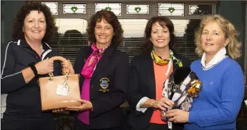  ??  ?? The presentati­on for the 18-hole v. par competitio­n sponsored by Emerald Dry Cleaners in New Ross (from left): Maria Burford (second), Mary Maher (lady Captain), Deirdre Caulfield (sponsor), Mary Rochford (Senior prize winner).