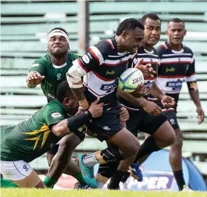  ?? Photo: Sereana Salalo ?? Naitasiri first five eight Peceli Nacebe (with ball) tries to escape a tackle from a Tailevu players during their Skipper Cup Round 2 clash at Ratu Cakobau Park, Nausori on March 9, 2024.