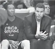  ?? Wally Skalij Los Angeles Times ?? BLAKE GRIFFIN, right, out for the playoffs, sits on the bench in street clothes next to Wesley Johnson.