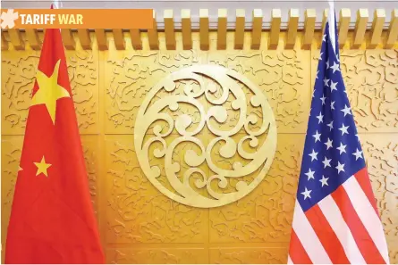  ?? — Reuters ?? Chinese and US flags are set up for a meeting during a visit by US Secretary of Transporta­tion Elaine Chao at China’s Ministry of Transport in Beijing in April.