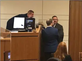  ?? MICHAEL FITZPATRIC­K — THE MORNING JOURNAL ?? Lorain County Common Pleas Judge D. Chris Cook talks with lawyers during a sidebar during a hearing in the Head Start case on Dec. 22.