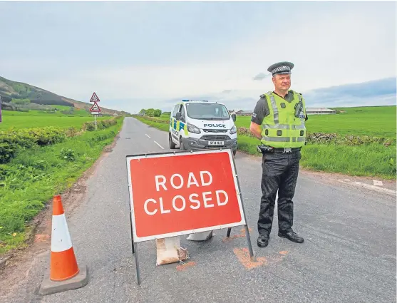  ?? Picture: Steve MacDougall. ?? Police closed the B8062 near Pairney Farm following the discovery of a woman’s body by the roadside.