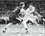  ?? Harry How Getty Images ?? J.J. REDICK, guarded here by Utah’s Joe Ingles, took only six shots in Game 1, scoring seven points.