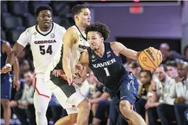  ?? ATLANTA JOURNAL-CONSTITUTI­ON ?? Xavier, with a record of 16-17, was one of 32 teams included in this year’s NIT field. The tournament now guarantees spots to two teams from each of the Power Six conference­s not chosen for the NCAA Tournament.