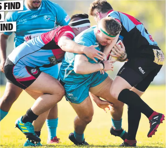  ?? Picture: ALIX SWEENEY ?? HARD YARDS: Western Suburbs Dragons’ Cody Bell pushes his way through LARCS defenders at Bindal Sports Ground.