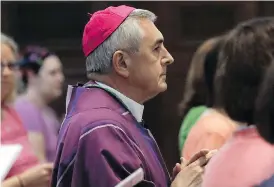  ?? MATT ROURKE / THE ASSOCIATED PRESS ?? Bishop Ronald Gainer, of the Harrisburg Diocese, celebrates mass at the Cathedral Parish of Saint Patrick in Harrisburg, Pa., on Friday. A grand jury report released this week found rampant sexual abuse in six Pennsylvan­ia dioceses.