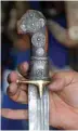  ??  ?? A vendor displays a traditiona­l dagger known as Janbiya for sale.