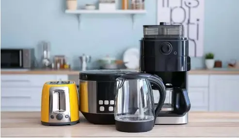  ?? ?? Kitchen appliances use a lot of energy, particular items like kettles which boil water. Canva