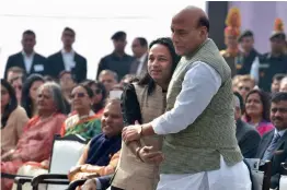  ?? — PTI ?? Union home minister Rajnath Singh congratula­tes singer Kailash Kher after the launch of “Bharat Ke Veer” anthem at an event in New Delhi on Saturday.
