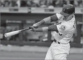  ?? JULIE JACOBSON/AP PHOTO ?? Michael Conforto drives in a run on a base hit against the Diamondbac­ks during the first inning of Friday’s game at New York. The Mets won 3-1.