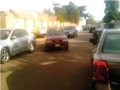  ??  ?? Visiting cars struggling for space outside late Solomon Lar’s Jos residence (left) yesterday