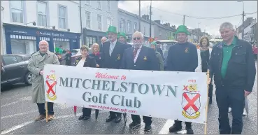  ?? ?? Mitchelsto­wn Golf Club members parade in town on St Patrick’s Day last Friday.