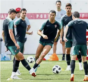  ??  ?? No time to relax: Portugal’s Cristiano Ronaldo (centre) training with teammates in Kratovo yesterday.