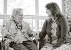  ?? Jeff Poole / Orange County Review via New York Times ?? Kim Bartley visits with Alice Jacobs, 90, at Dogwood Village, a nonprofit county-owned nursing home in Orange, Va. Medicaid pays for most of the 1.4 million elderly people in nursing homes.