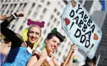  ?? — AFP ?? SYDNEY: This picture shows demonstrat­ors taking part in a same-sex marriage rally in Sydney.