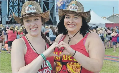  ?? MAUREEN COULTER/THE GUARDIAN ?? Country music fans Danie Pitre, left, and Shanel Degrace of Nigadoo, N.B., said they are excited to attend their first Cavendish Beach Music Festival this weekend. Pitre and Degrace are looking forward to Sunday performanc­es by Tim Hicks and Zac Brown...