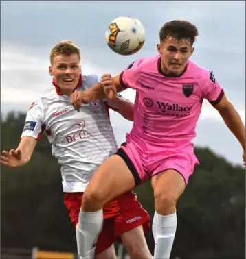  ??  ?? Aaron Dobbs of Wexford F.C. battles with Shelbourne’s Derek Prendergas­t in the air.