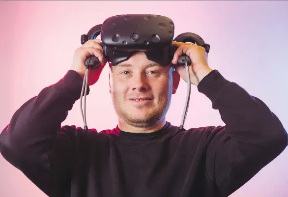  ?? GERRY KAHRMANN ?? Hammer & Tusk leader Mack Flavelle wears a VR headset at the firm’s virtual reality studio in Vancouver.