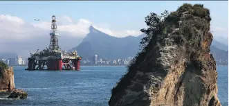  ?? DAVID SILVERMAN/GETTY IMAGES FILES ?? An oil drilling platform is shown in Rio de Janeiro. The Canadian oilpatch is seen to be in better shape than a year ago, with projected competitio­n for longer cycle projects.