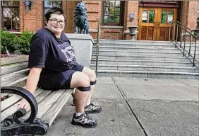  ?? Paul Buckowski / Times Union ?? Darlene Mcgraw has left messages drawn in chalk in front of Saratoga City Hall about the issue of sidewalks in the city not being ADA compliant.