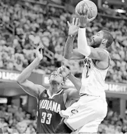  ?? TONY DEJAK/ASSOCIATED PRESS ?? Cleveland guard Kyrie Irving, who hit 14 of 24 shots from the field, including 4 of 10 from 3-point range, drives to the basket against Myles Turner Monday night.