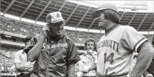  ?? AP 1978 ?? Former Braves pitcher Phil Niekro (left) interviews Reds star Pete Rose before a game in Atlanta on July 31, 1978. Later that day, Rose extended his hitting streak to 44 games, tying the NL record. “I faced 19 Hall of Fame pitchers in the 1970s and 1980s,” Rose says. “I don’t know if guys today are facing 19 Hall of Fame pitchers.”