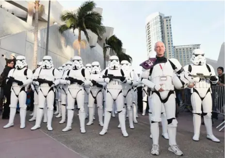  ?? MICHAEL BUCKNER/GETTY IMAGES FOR DISNEY ?? Members of the 501st Legion, a group of Stormtroop­er cosplayers, have a good relationsh­ip with Star Wars creator George Lucas and Lucasfilm.
