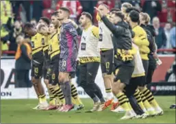  ?? (DPA) ?? Borussia Dortmund players thank the spectators after the victory in the German Bundesliga match against Union Berlin at Stadium An der Alten Foersterei.