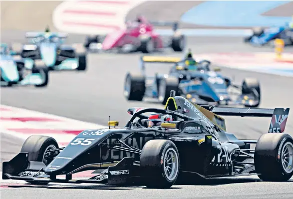  ?? ?? Serial winner: Jamie Chadwick races round Circuit Paul Ricard en route to victory at Le Castellet in July; (below) celebratin­g on the podium after her triumph at Silverston­e earlier that month