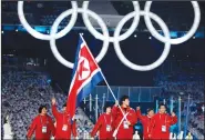  ?? File Photo/AP ?? North Korea's Song Chol Ri carries the flag during the opening ceremony Feb. 12, 2010, for the Vancouver Olympics in Vancouver, Canada.