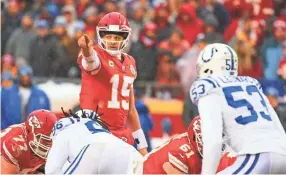  ?? JAY BIGGERSTAF­F/USA TODAY SPORTS ?? Chiefs quarterbac­k Patrick Mahomes checks the defense before a snap against the Colts in an AFC divisional playoff game.