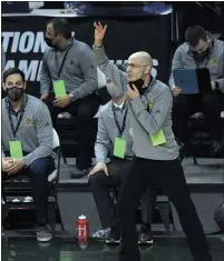  ??  ?? Coach Gjon Djokaj signals from the De La Salle bench during a Division 1semifinal game against Ann Arbor Huron.