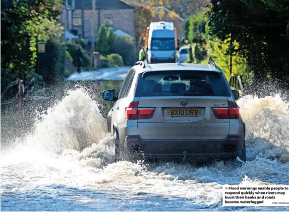  ?? Peter Harbour ?? > Flood warnings enable people to respond quickly when rivers may burst their banks and roads become waterlogge­d