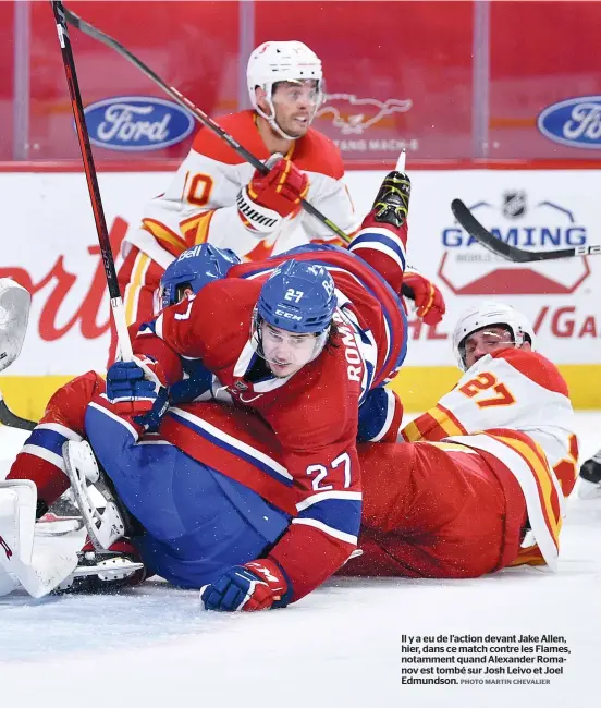  ?? PHOTO MARTIN CHEVALIER ?? Il y a eu de l’action devant Jake Allen, hier, dans ce match contre les Flames, notamment quand Alexander Romanov est tombé sur Josh Leivo et Joel Edmundson.