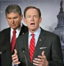  ?? J. SCOTT APPLEWHITE — THE ASSOCIATED PRESS FILE ?? U.S. Sen. Patrick Toomey, R-Pa., right, speaks alongside U.S. Sen. Joe Manchin, D-W.Va., left, as they discuss reaching a bipartisan agreement that would expand background checks to more gun buyers, during a news conference on Capitol Hill in...