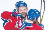  ?? CP PHOTO ?? Montreal Canadiens’ Alexander Radulov, left, celebrates his winning goal against the New York Rangers with teammate Jordie Benn during overtime in Game 2 NHL Stanley Cup first-round playoff hockey game action Friday, April 14, 2017, in Montreal.