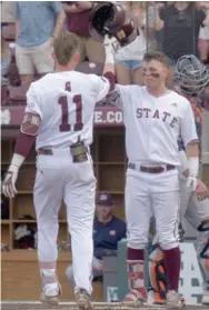  ?? Daily News) (Photo by Craig Jackson, for Starkville ?? Mississipp­i State's Jordan Westburg, left, celebrates this home run against Auburn Saturday with teammate Tanner Allen.