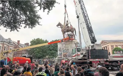  ?? RYAN M. KELLY AFP VIA GETTY IMAGES ?? The statue of Stonewall Jackson is one of five taken down in Richmond in recent weeks. Christophe­r Columbus’s was another.