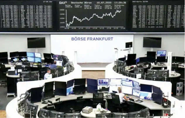  ?? Reuters ?? The German share price index DAX graph is pictured at the stock exchange in Frankfurt on Friday.