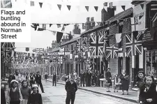  ??  ?? Flags and bunting abound in Norman Street