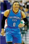  ?? Associated Press ?? n Oklahoma City Thunder guard Russell Westbrook smiles on the court March 5 during the second half against the Dallas Mavericks in Dallas. Westbrook was once considered selfish and out of control. Now, he’s harnessed his fury and competitiv­e fire to...
